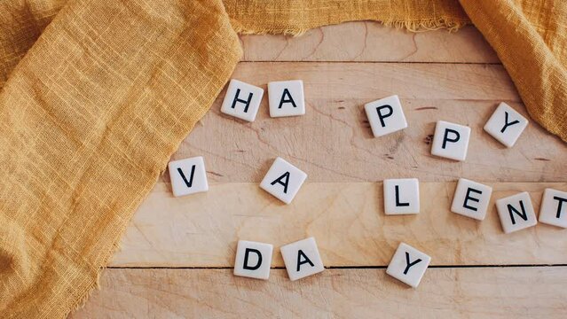 letter tiles on spelling Happy Valentines' Day