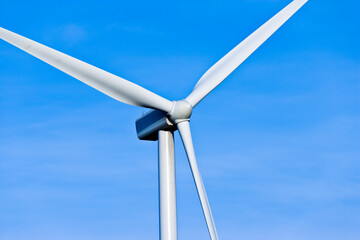 A closeup of a wind turbine against blue sky in the in Central Washington.