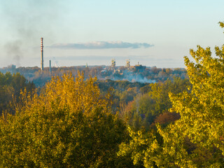 View from the drone on the smoke from the chimneys of houses. Concept of care for the environment, air pollution in the city from chimneys.