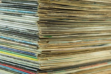 A stack of old LP record covers. Art and a piece of contemporary history. Unlike streaming music,...