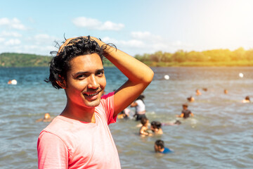 Hispanic gay posing and looking at camera in a lake of Managua, Nicaragua. Phot with copy space
