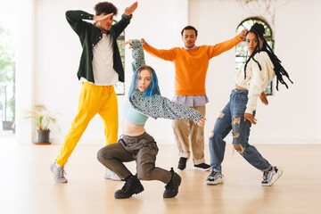 Image of diverse female and male hip hop dancers during training in dance club