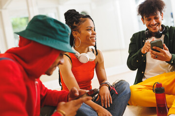 Image of low section of group of group of diverse female and male hip hop dancers in studio