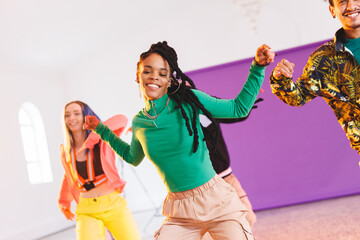 Image of group of group of diverse female and male hip hop dancers taking part in photo shot