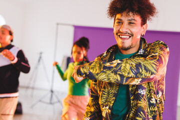 Image of group of group of diverse female and male hip hop dancers taking part in photo shot