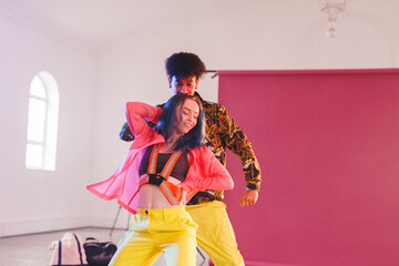 Fototapeta premium Image of happy diverse female and male hip hop dancers in studio