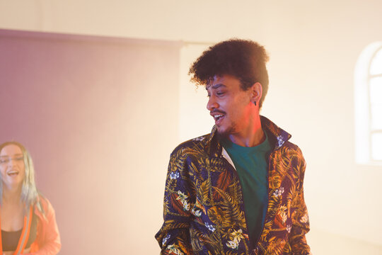Image of happy biracial male dancer in dance studio