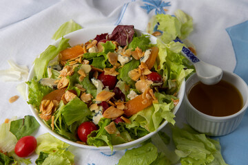 Plate of salad on white tablecloth
