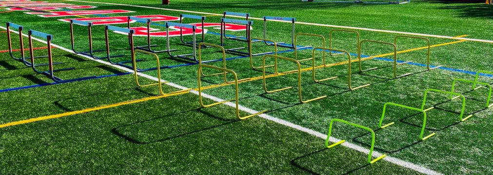 Hurdlew on a turf field for stength and agility practice