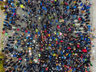Aerial drone view of large group of people on the street. Crowd of people, view from above. People on protest. - obrazy, fototapety, plakaty