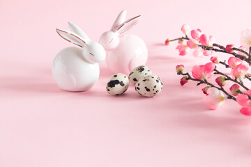 Easter rabbit on light pastel pink background. Easter holiday concept. copy space, close-up 
