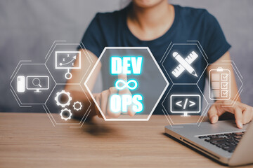 DevOps concept, Woman hand touching DevOps icon on VR screen on desk, Methodology development...