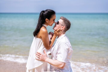 Love couple on holiday happy playing running along the beach and wedding proposed on love emotion