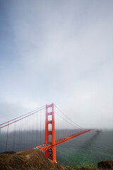 Golden Gate Bridge half covered by fog