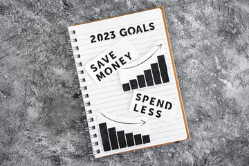 spend less and save money texts with graphs showing expenses going down and savings going up on...