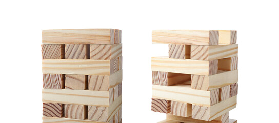 Jenga towers of wooden blocks on white background