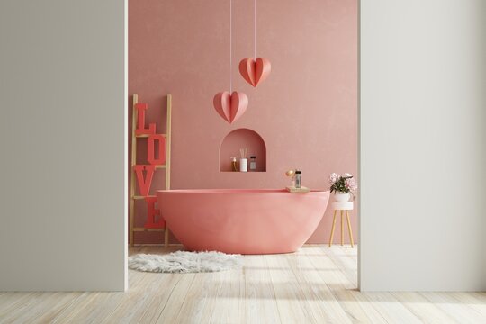 Valentine's day in bathroom with bathtub on empty red wall.