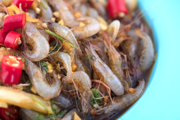 Fresh raw and pickled river shrimp close-up plate