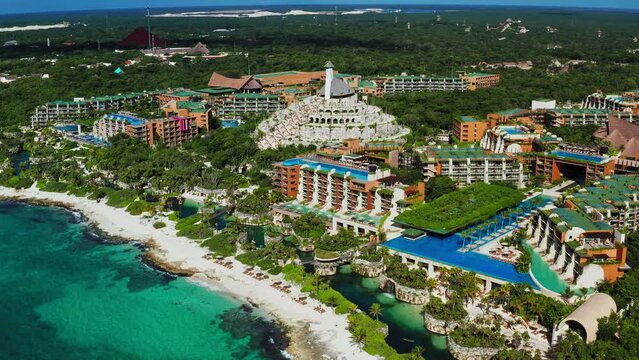 Flying high unveiling the beautiful Xcaret Arte Resort and the tropical beach in Playa del Carmen, Quintana Roo, Mexico.