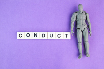 miniature people with alphabet letters of the word conduct. the concept of behavior. the manner in which a person behaves.