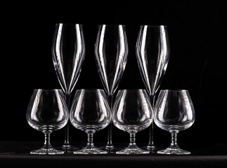 Wine glasses silhouettes on black background