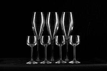 Wine glasses silhouettes on black background