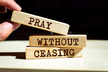 Wooden blocks with words 'Pray Without Ceasing'.