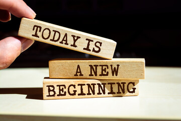 Wooden blocks with words 'Today is a new beginning'. Inspirational and Motivational Quote