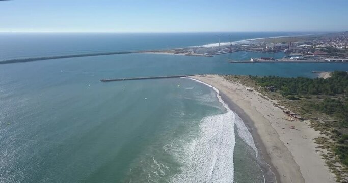 famous cabedelo beach in Viana do Castelo in Portugal. kite surfer enjoying the wind and waves.