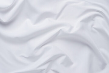 White fabric. luxurious white fabric texture background. Creases of satin, silk and cotton.	