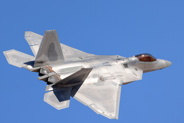 Close tail  view of a F-22 Raptor in beautiful light