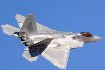 Close tail  view of a F-22 Raptor in beautiful light