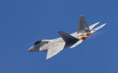 Close tail  view of a F-22 Raptor,  with afterburners on 