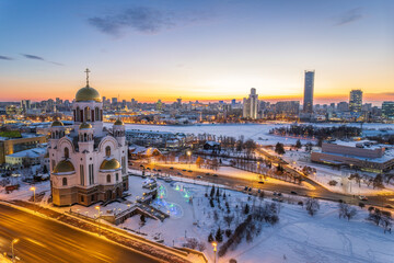 Winter Yekaterinburg and Temple on Blood in beautiful blue clear sunset. Aerial view of Yekaterinburg, Russia. Translation of the text on the temple: Honest to the Lord is the death of His saints.