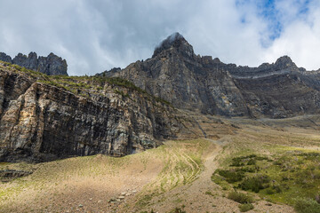 cliff walls in the clouds with dramatic lighting