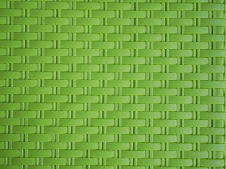 green artificial rattan weave texture background.