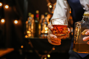 Bartender pouring Whiskey, on  bar