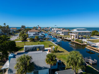 Seaside houses and buildings in a gulf of mexico canal in Florida from drone
