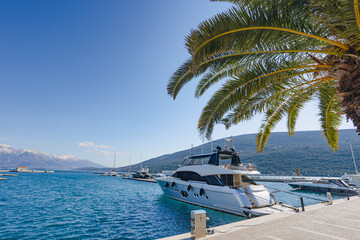 Yachts under blue sky moored in the protected bay of the Adriatics.