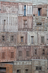 Old wooden windows hidden in traditional texture and background.