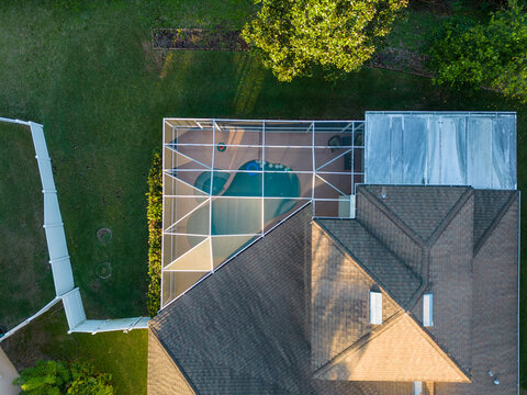 Pool Screen Enclosure Of Tampa Bay Florida Home In Neighborhood From Aerial Drone