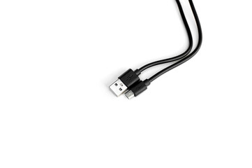 Black USB cable isolated on black background.