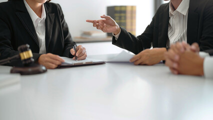 Lawyer discuss the contract and legal document agreement in office. Law and legal concept