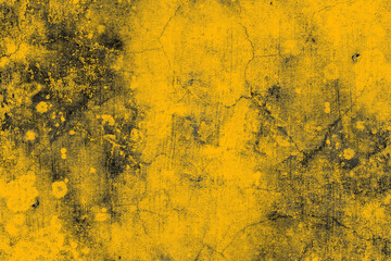 Damaged old yellow concrete wall with dark grunge texture