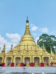 Fototapeta premium Replica Of Shwedagon Pagoda royalty At Phutthasuwan Chedi temple, Ranong, Thailand.