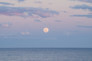 moonrise full moon over the sea sunset Byron bay Australia 