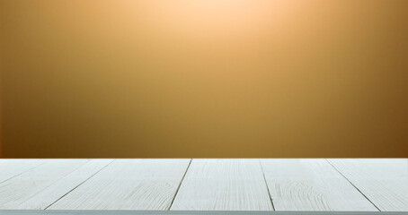 Wooden table on gold brown gradient blurred background for placement of products