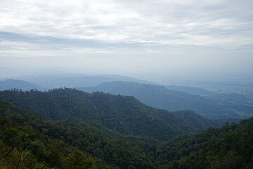 Fototapeta na wymiar Natural landscape of green mountain range with cloudy blue sky