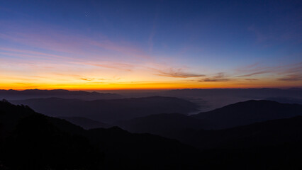 Night sky with moon before sunset on mountain at .Doi Phu Kha of Thailand for background.