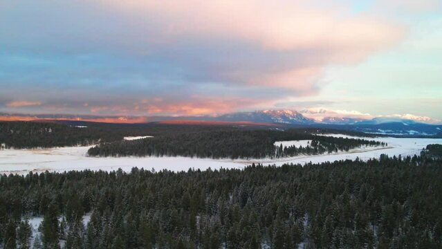The Canadian Rocky Mountains at Sunset: A Snowy Forest Captured from Above